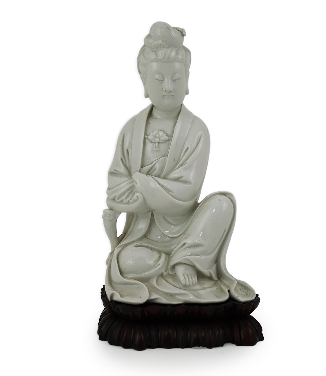A Chinese blanc-de-chine seated figure of Guanyin, late 19th/early 20th century